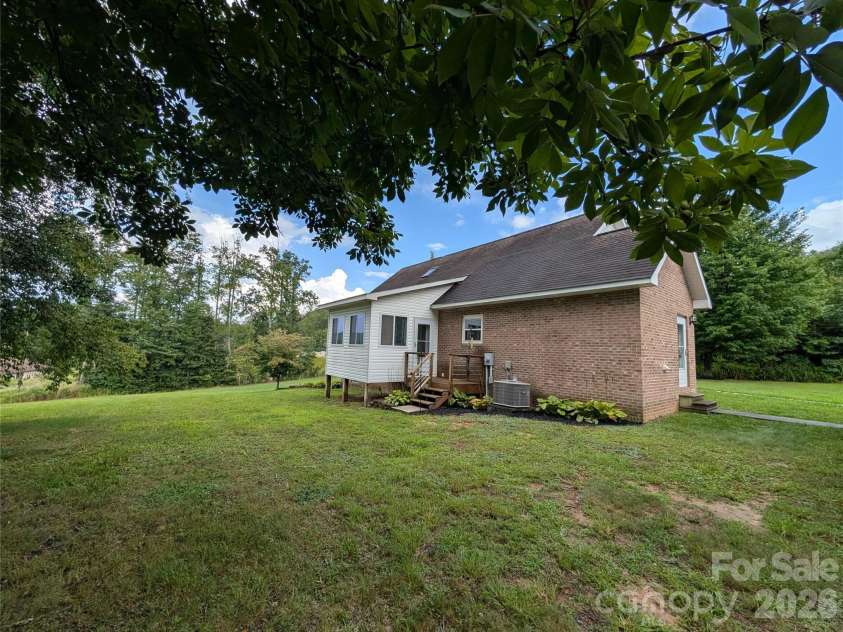 213 Rustling Pines Drive, Hendersonville, NC 28792.  MLS# CAR4418354, YatesRealty ID 46806. Back of Home Property View