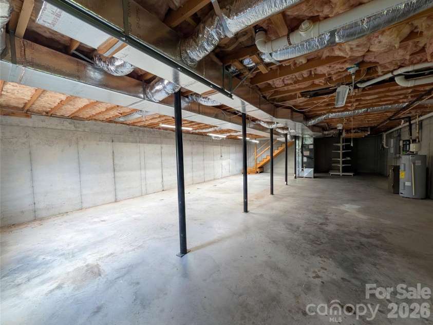 213 Rustling Pines Drive, Hendersonville, NC 28792.  MLS# CAR4418354, YatesRealty ID 46806. Basement Unfinished w/ Outside entry and Garage Doors