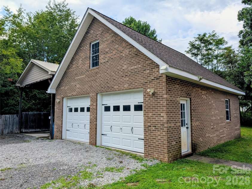 213 Rustling Pines Drive, Hendersonville, NC 28792.  MLS# CAR4418354, YatesRealty ID 46806. Detached Garage/ Workshop with RV Storage 50 AMP