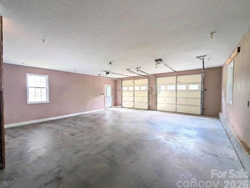 213 Rustling Pines Drive, Hendersonville, NC 28792.  MLS# CAR4418354, YatesRealty ID 46806. Downstairs Detached Garage