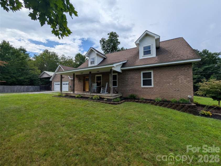 213 Rustling Pines Drive, Hendersonville, NC 28792.  MLS# CAR4418354, YatesRealty ID 46806. Front of Home