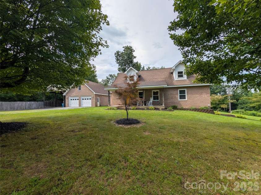 213 Rustling Pines Drive, Hendersonville, NC 28792.  MLS# CAR4418354, YatesRealty ID 46806. Front View of Home
