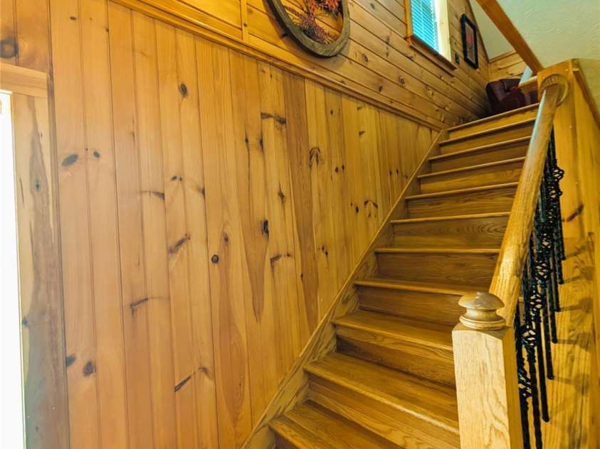 213 Rustling Pines Drive, Hendersonville, NC 28792.  MLS# CAR4418354, YatesRealty ID 46806. Wooden Staircase