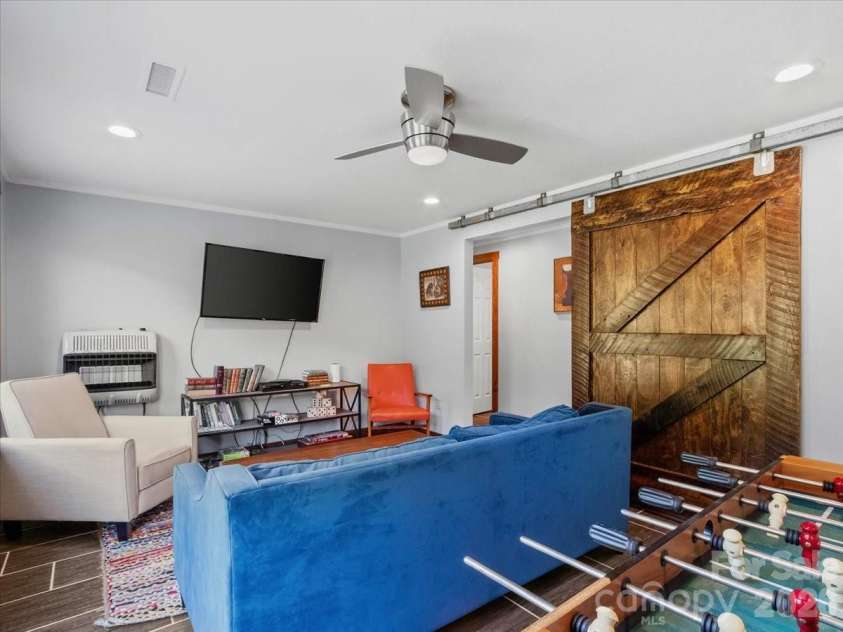 359 Shull Farm Road, Burnsville, NC 28714.  MLS# CAR4418216, YatesRealty ID 46807. Large textured rustic barndoor!