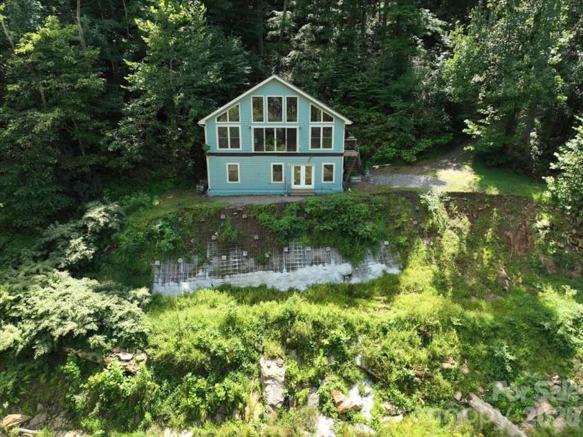 359 Shull Farm Road, Burnsville, NC 28714.  MLS# CAR4418216, YatesRealty ID 46807. Surrounded by lush native tapestry!