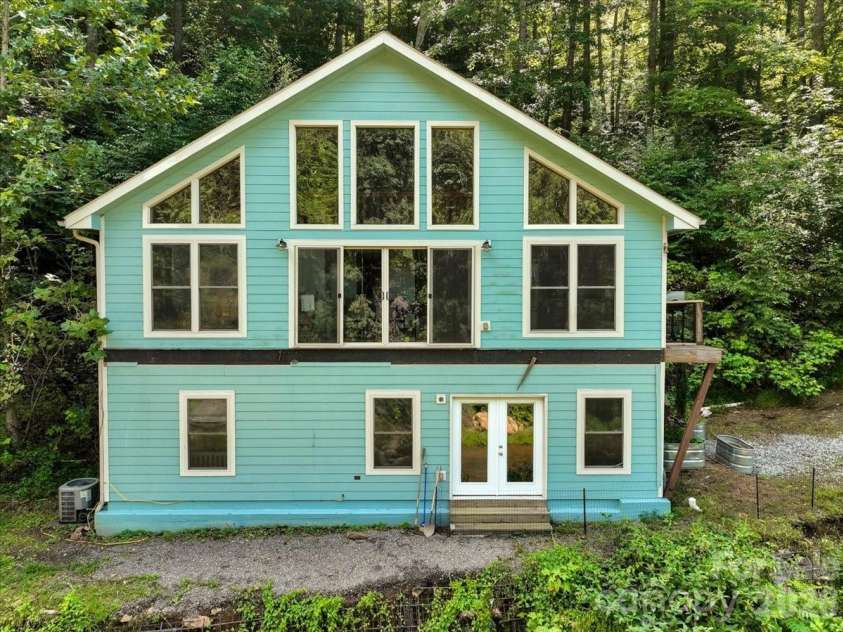 359 Shull Farm Road, Burnsville, NC 28714.  MLS# CAR4418216, YatesRealty ID 46807. Wall to wall windows!