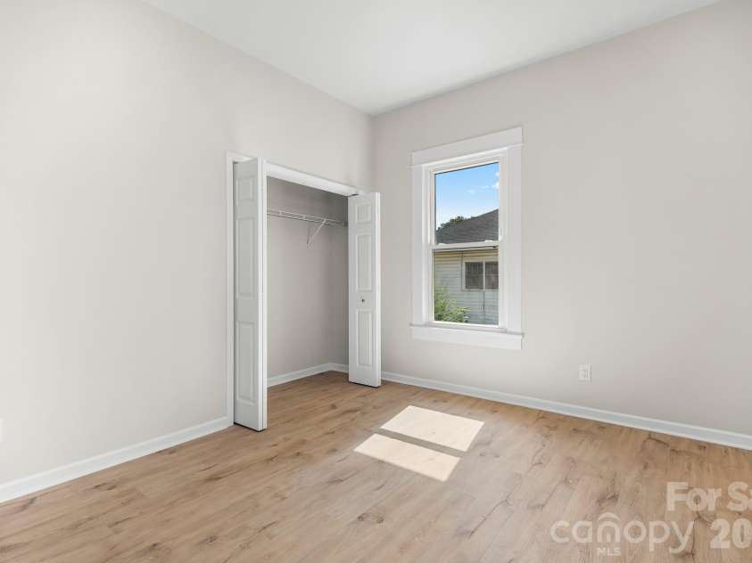 104 1st Avenue, China Grove, NC 28023.  MLS# CAR4418382, YatesRealty ID 46813. Bedroom 1. Bright bedroom with a spacious closet and natural light