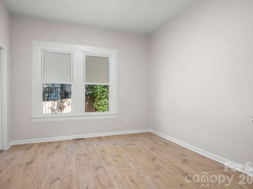 104 1st Avenue, China Grove, NC 28023.  MLS# CAR4418382, YatesRealty ID 46813. Spacious primary bedroom with two closets.