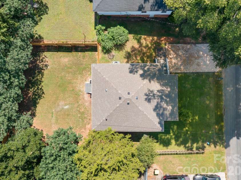 104 1st Avenue, China Grove, NC 28023.  MLS# CAR4418382, YatesRealty ID 46813. Surrounded by mature trees