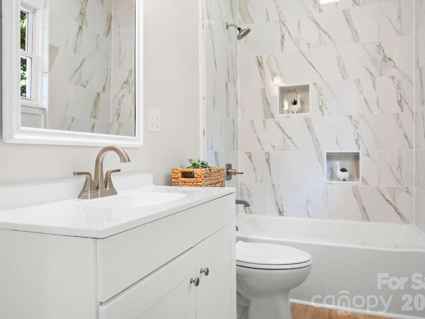 104 1st Avenue, China Grove, NC 28023.  MLS# CAR4418382, YatesRealty ID 46813. Tub/shower combo with matching brushed nickel hardware