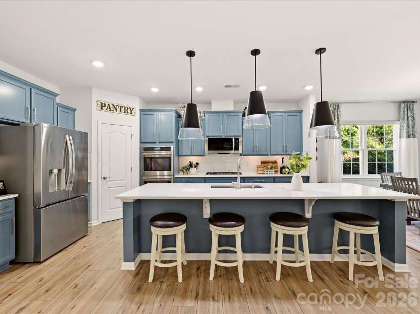 5060 Big Bend Drive, Lancaster, SC 29720.  MLS# CAR4414688, YatesRealty ID 46826. Large Center Island, Quartz Counters, Walk in Pantry with Solid Shelving. Pull out Shelving on Lower Cabinets