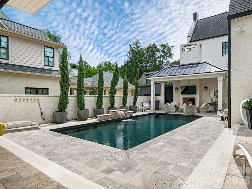 1202 Townes Road, Charlotte, NC 28209.  MLS# CAR4416588, YatesRealty ID 46834. Gorgeous Travertine Courtyard
