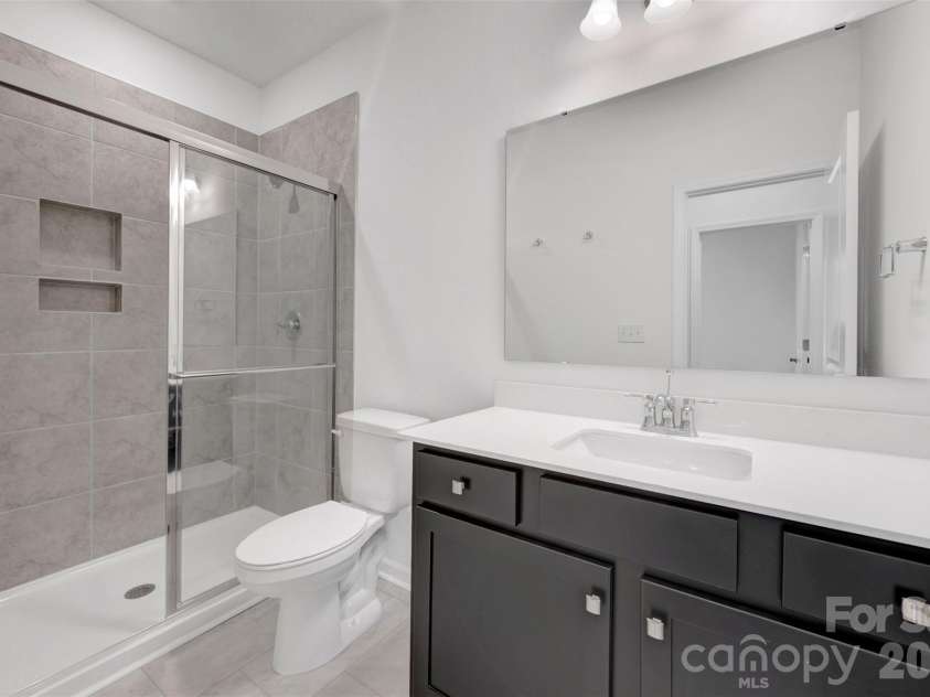 245 Amber Glen Drive, Locust, NC 28097.  MLS# CAR4416138, YatesRealty ID 46852. First floor bathroom