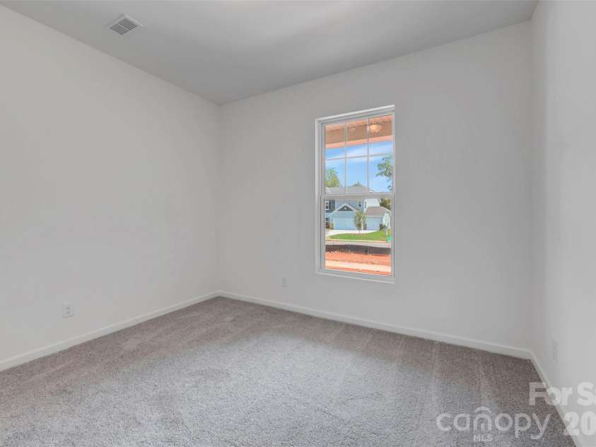245 Amber Glen Drive, Locust, NC 28097.  MLS# CAR4416138, YatesRealty ID 46852. First floor bedroom