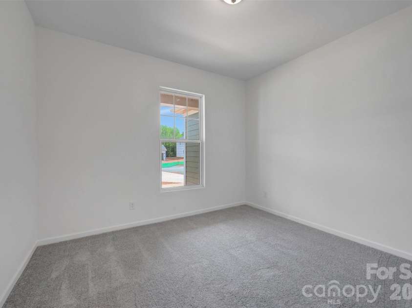 245 Amber Glen Drive, Locust, NC 28097.  MLS# CAR4416138, YatesRealty ID 46852. First floor bedroom