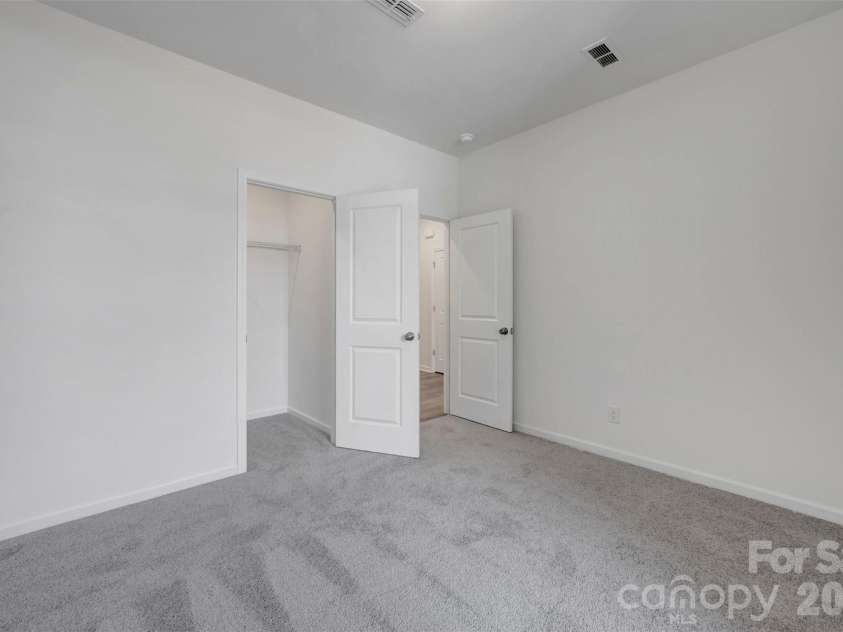 245 Amber Glen Drive, Locust, NC 28097.  MLS# CAR4416138, YatesRealty ID 46852. First floor bedroom