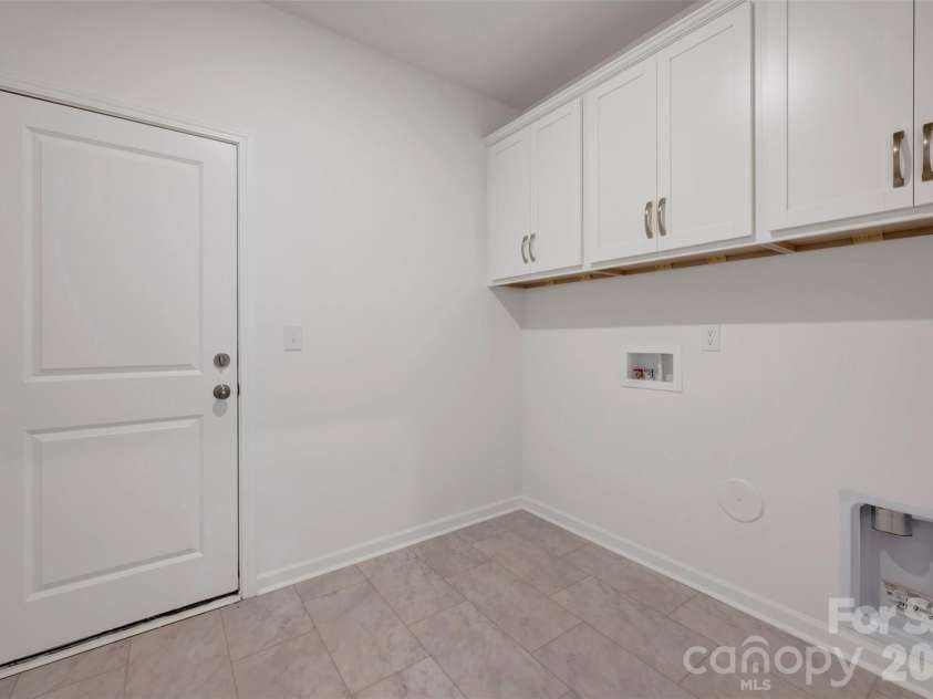 245 Amber Glen Drive, Locust, NC 28097.  MLS# CAR4416138, YatesRealty ID 46852. Laundry area