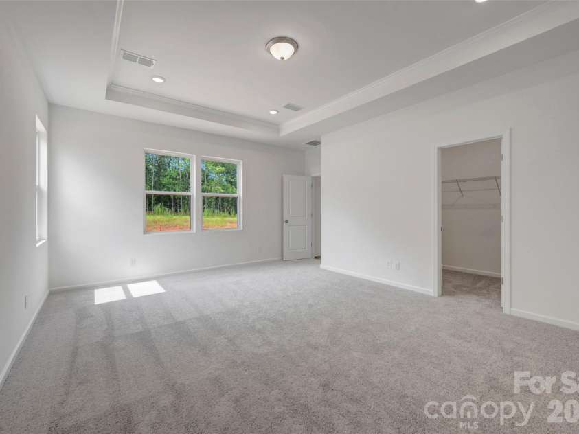 245 Amber Glen Drive, Locust, NC 28097.  MLS# CAR4416138, YatesRealty ID 46852. Owner's suite