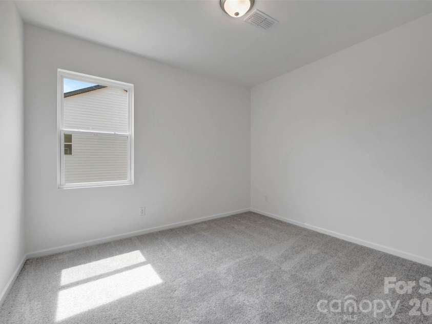 245 Amber Glen Drive, Locust, NC 28097.  MLS# CAR4416138, YatesRealty ID 46852. Secondary bedroom