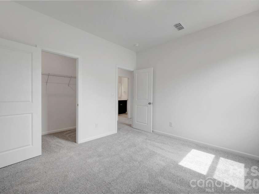245 Amber Glen Drive, Locust, NC 28097.  MLS# CAR4416138, YatesRealty ID 46852. Secondary bedroom