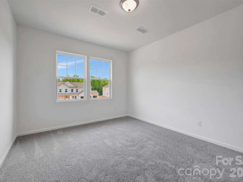 245 Amber Glen Drive, Locust, NC 28097.  MLS# CAR4416138, YatesRealty ID 46852. Secondary bedroom