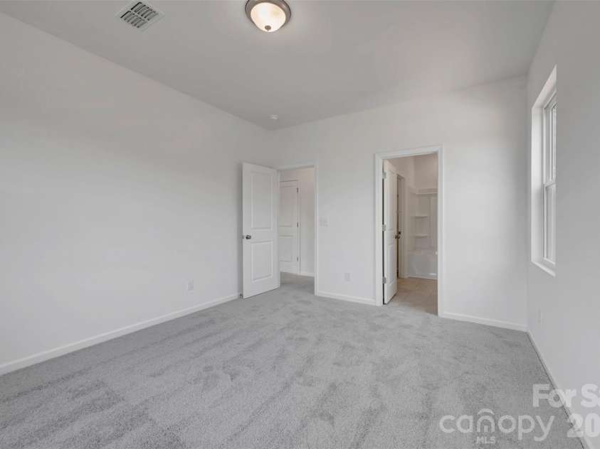 245 Amber Glen Drive, Locust, NC 28097.  MLS# CAR4416138, YatesRealty ID 46852. Secondary bedroom