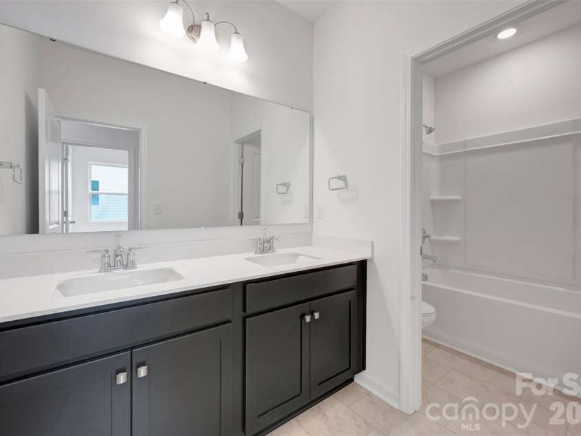 245 Amber Glen Drive, Locust, NC 28097.  MLS# CAR4416138, YatesRealty ID 46852. Secondary shared bathroom