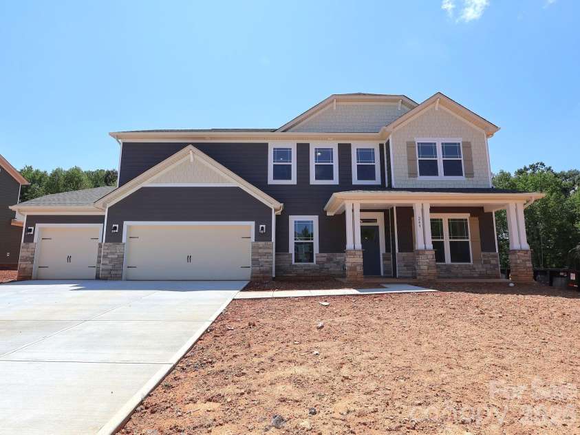 249 Amber Glen Drive, Locust, NC 28097.  MLS# CAR4416144, YatesRealty ID 46853. Exterior. Sod will be installed once home is sold