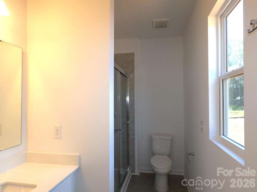 249 Amber Glen Drive, Locust, NC 28097.  MLS# CAR4416144, YatesRealty ID 46853. First floor guest suite