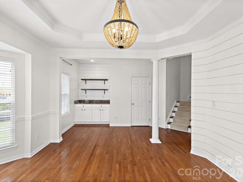 7600 Turley Ridge Lane, Charlotte, NC 28273.  MLS# CAR4413385, YatesRealty ID 46876. Designer lighting and built-in bar.
