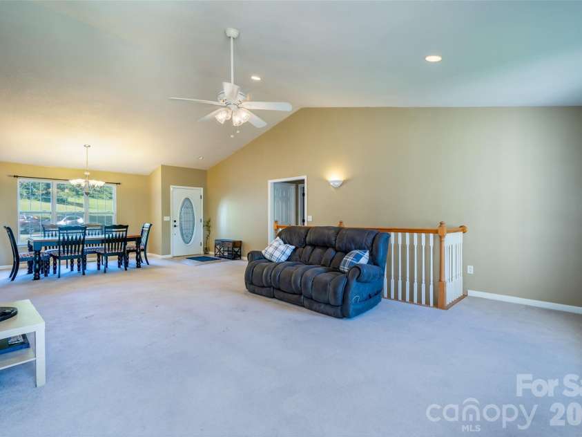 151 Willard Lane, Hendersonville, NC 28792.  MLS# CAR4281738, YatesRealty ID 4690. Living room with high arching ceiling