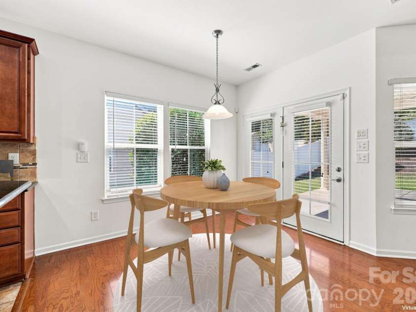 593 Harrison Drive, Concord, NC 28027.  MLS# CAR4413836, YatesRealty ID 46904. Breakfast nook in kitchen virtually staged