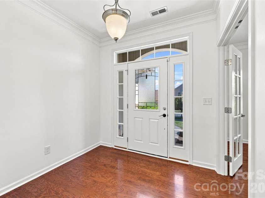 593 Harrison Drive, Concord, NC 28027.  MLS# CAR4413836, YatesRealty ID 46904. Front entryway - French doors open to the office