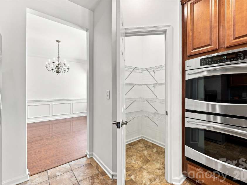 593 Harrison Drive, Concord, NC 28027.  MLS# CAR4413836, YatesRealty ID 46904. Large pantry in kitchen - double ovens
