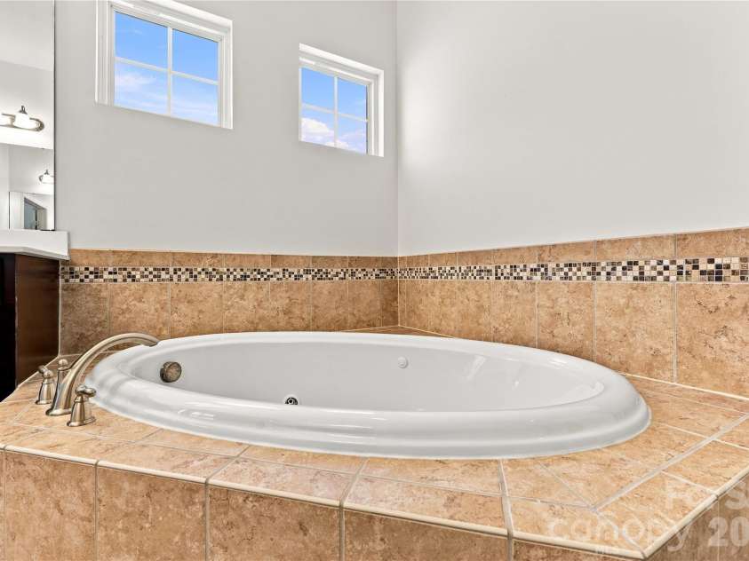 593 Harrison Drive, Concord, NC 28027.  MLS# CAR4413836, YatesRealty ID 46904. Primary bath jetted tub