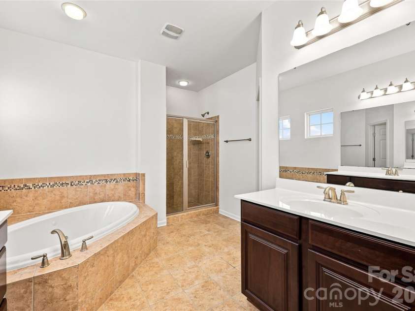 593 Harrison Drive, Concord, NC 28027.  MLS# CAR4413836, YatesRealty ID 46904. Primary bathroom with double sinks, jetted tub and separate shower