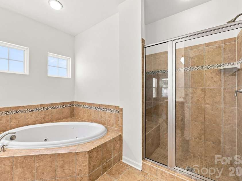 593 Harrison Drive, Concord, NC 28027.  MLS# CAR4413836, YatesRealty ID 46904. Primary bathroom with jetted tub and separate shower