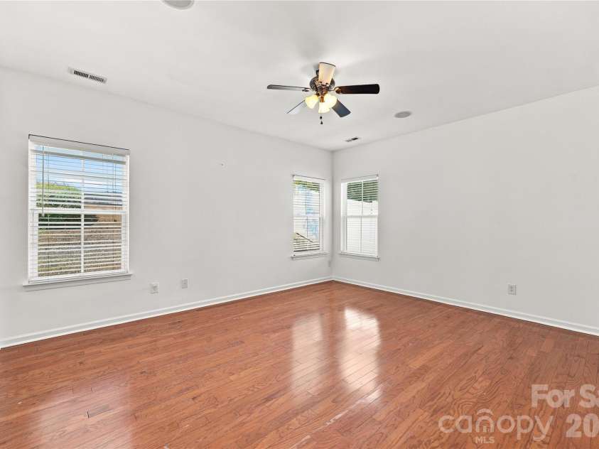 593 Harrison Drive, Concord, NC 28027.  MLS# CAR4413836, YatesRealty ID 46904. Primary bedroom with ceiling fan