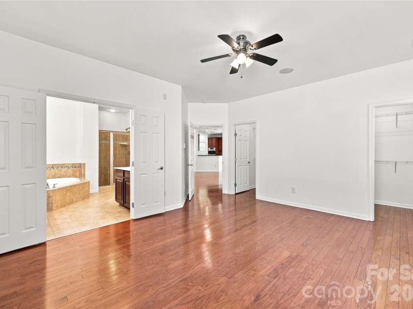 593 Harrison Drive, Concord, NC 28027.  MLS# CAR4413836, YatesRealty ID 46904. Primary bedroom with ceiling fan, double closets and ensuite bath