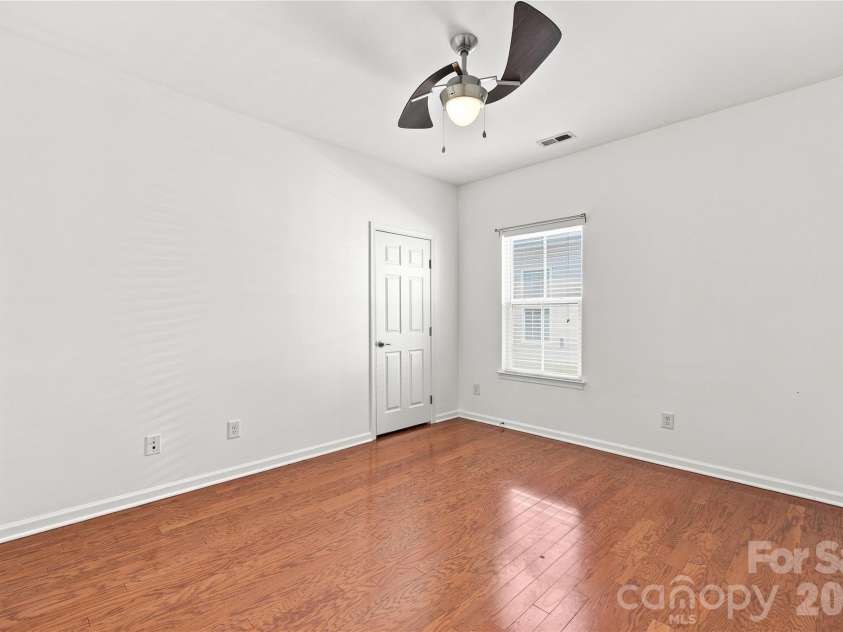 593 Harrison Drive, Concord, NC 28027.  MLS# CAR4413836, YatesRealty ID 46904. Third bedroom with ceiling fan and closet