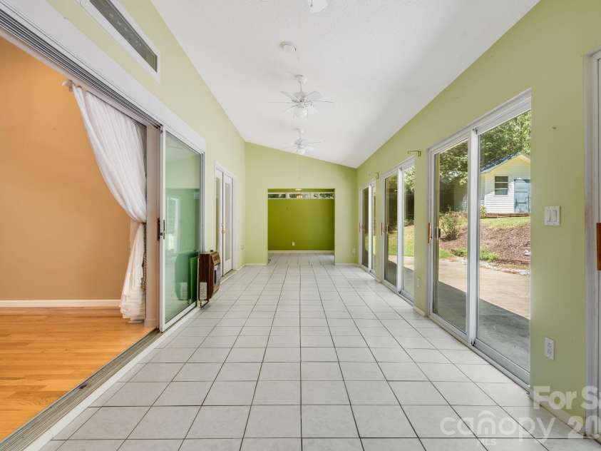 225 Arbor Lane, Hendersonville, NC 28791.  MLS# CAR4418437, YatesRealty ID 46913. Spacious and Bright Sunroom!