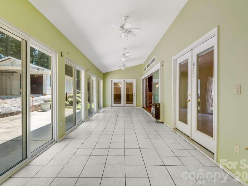 225 Arbor Lane, Hendersonville, NC 28791.  MLS# CAR4418437, YatesRealty ID 46913. Spacious and Bright Sunroom!