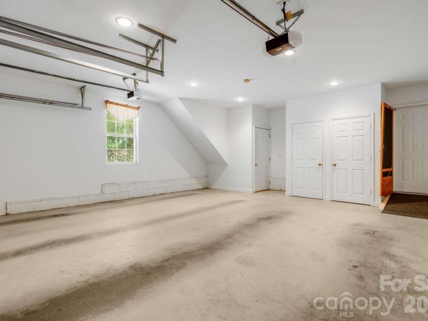 225 Arbor Lane, Hendersonville, NC 28791.  MLS# CAR4418437, YatesRealty ID 46913. Spacious Double-car Garage