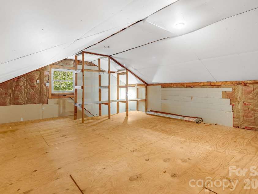 225 Arbor Lane, Hendersonville, NC 28791.  MLS# CAR4418437, YatesRealty ID 46913. Stair-accessed Storage over Garage