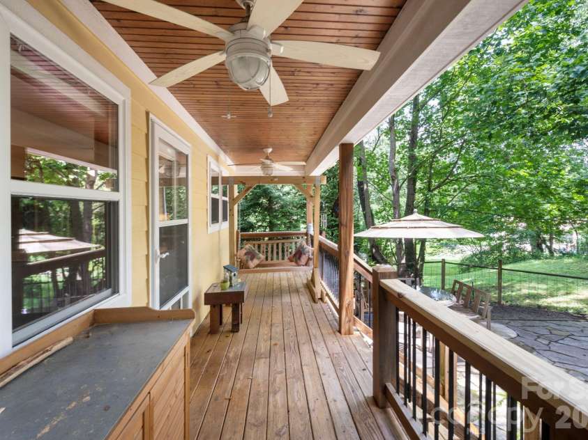 15 Riverlink Lane, Asheville, NC 28806.  MLS# CAR4417992, YatesRealty ID 46922. Covered Back Deck Spans the Home