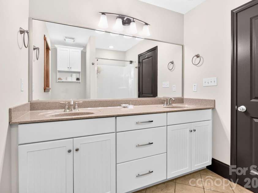 15 Riverlink Lane, Asheville, NC 28806.  MLS# CAR4417992, YatesRealty ID 46922. Ensuite Bath Includes a Walk-In Shower