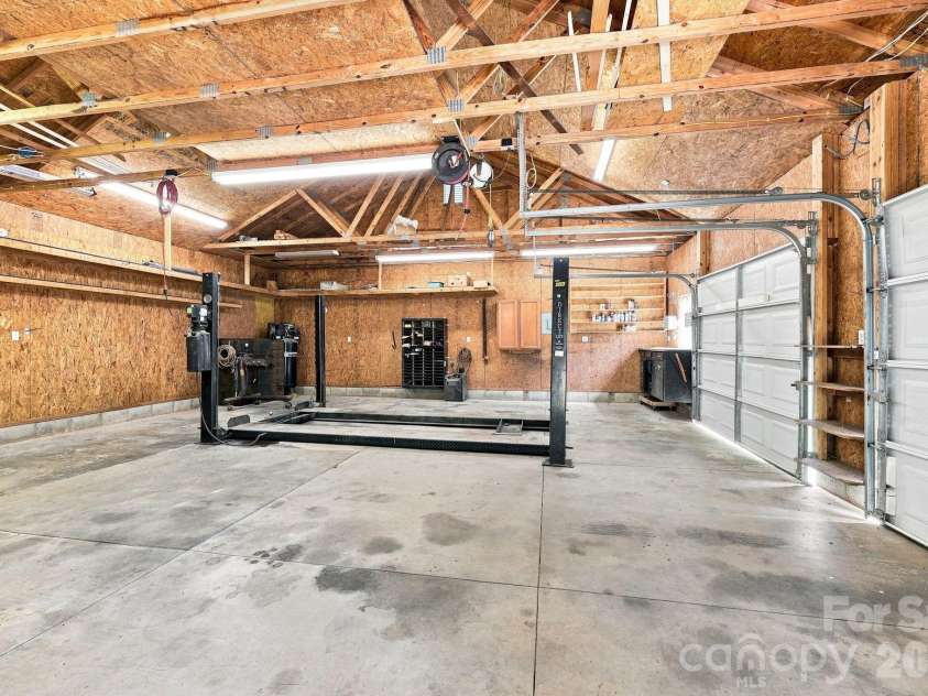 1395 Ebenezer Road, China Grove, NC 28023.  MLS# CAR4418139, YatesRealty ID 46945. Garage with lift