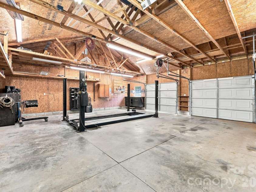 1395 Ebenezer Road, China Grove, NC 28023.  MLS# CAR4418139, YatesRealty ID 46945. Garage with lift