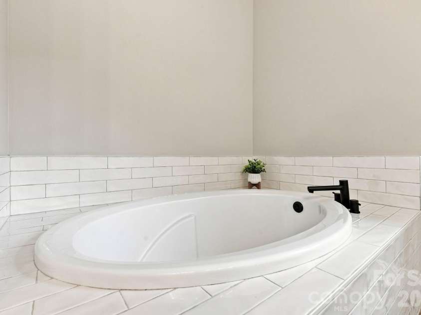 1395 Ebenezer Road, China Grove, NC 28023.  MLS# CAR4418139, YatesRealty ID 46945. Soaking tub in primary bathroom