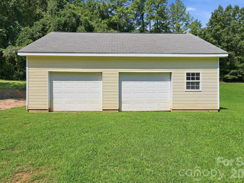 1395 Ebenezer Road, China Grove, NC 28023.  MLS# CAR4418139, YatesRealty ID 46945. Two bay garage